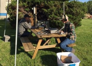 image of two men using ham radio